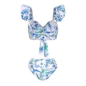 Detailed view of floral bikini set with ruffle straps and tropical leaf print pattern