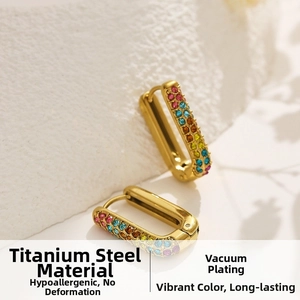 Detailed close-up of 18k gold plated titanium earrings with colorful square zircons
