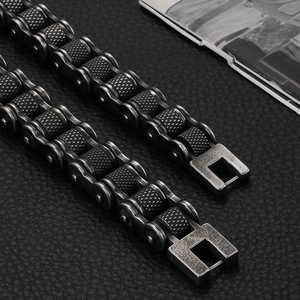 Detailed close-up of heavy metal bicycle chain bracelet with industrial textured links