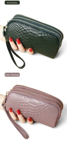 Detail of dark green and lilac snakeskin leather clutches with triple zipper design