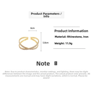 Detail of cross design gold bracelet featuring rhinestones with 6cm by 5.8cm dimensions