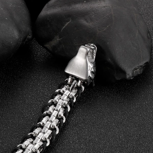 Men's leather rope bracelet with woven diamond pattern and silver wolf head clasp