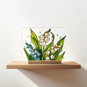 Detailed view of 3D lily of the valley pattern on clear acrylic plate with wood base