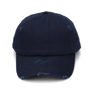 Detail of distressed navy cotton canvas baseball cap with vintage worn-out holes