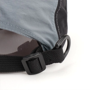 Detailed close-up of quick-dry baseball cap with adjustable strap and plastic buckle