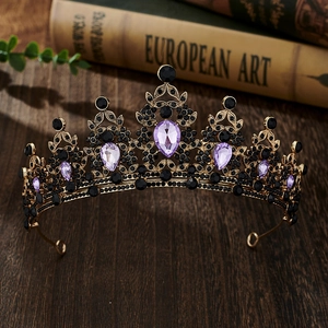 Detailed macro view of vintage gold bridal crown with black and purple crystal gems