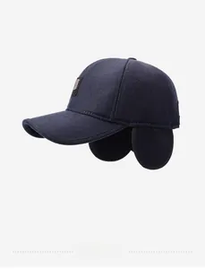 Detail view of winter baseball cap with ear flaps and navy wool texture finish