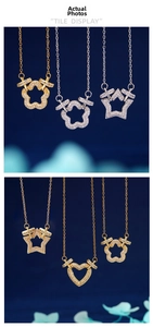 Detailed tile display of heart and star pendants with pavé zircon in gold and silver