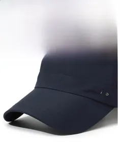 Detail of the navy blue sports cap showing the stiff brim and micro-textured quick-dry fabric