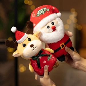 Plush Santa Claus and reindeer dolls held by hands with warm Christmas lights backdrop