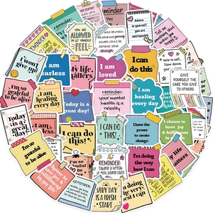 Macro view of fifty colorful self-affirmation stickers with motivational quotes on white background