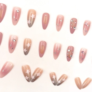 Almond blush star press-on nails with mixed rhinestones and glitter accents