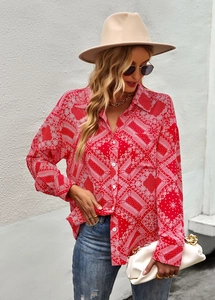 Red paisley print long sleeve button-up shirt styled with blue jeans and accessories