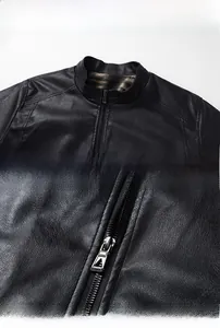 Detail of black leather jacket featuring stand collar, metal zipper and warm fleece lining