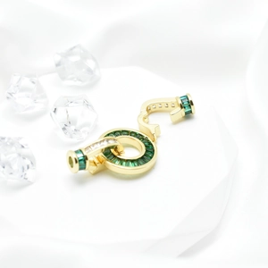 Exquisite gold-plated jewelry clasp with micro-set green and clear cubic zirconia