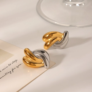 Two-tone twisted knot stud earrings in gold and silver polished stainless steel