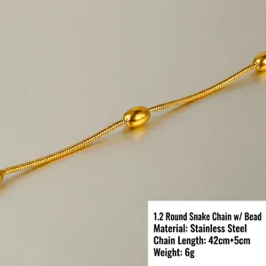 Macro view of 18k gold plated stainless steel snake chain with polished oval beads detail