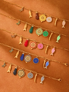 Detail of 18k gold plated enamel fish bracelets in six vibrant color combinations