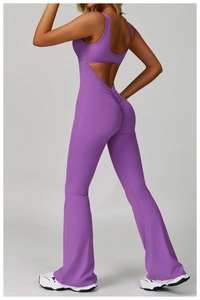 Macro detail of purple backless yoga jumpsuit showing butt-lifting scrunch and flare leg fit