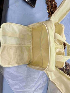 Detail view of large travel toiletry bag interior with mesh pockets and elastic bands