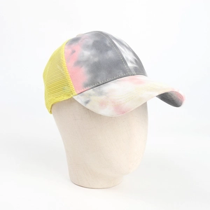Tie-dye ponytail baseball cap with pink and grey patterns and yellow mesh back