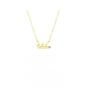 Detail view of gold S925 sterling silver necklace with lucky number 444 and single zircon