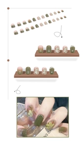 Detail showing 24pcs press-on nails with camellia floral design and pearl embellishments
