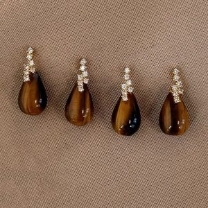 Tiger eye stone teardrop earrings with gold plating and cubic zirconia accents