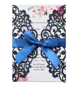 Navy blue glitter laser-cut wedding invitation with satin ribbon and floral insert card
