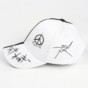 Detail view of cotton baseball cap featuring graffiti patterns and star graphics