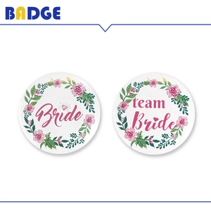 Detail of floral Bride and Team Bride badges for bridal showers and bachelorette parties