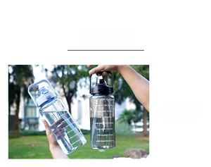 Detail of 2L sports water bottle showing time markings and portable handle design