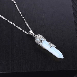 Hexagonal white crystal stone pendant necklace with silver flower and butterfly detail