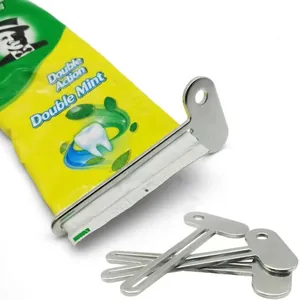 Manual metal toothpaste squeezer in silver key shape for hand cream and lotions