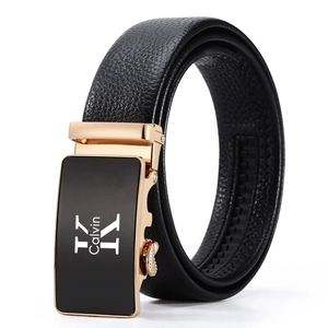 Detail of black leather belt featuring a gold and black automatic alloy buckle with engraving