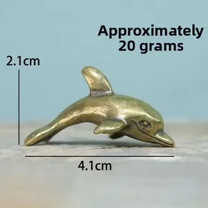 Detailed dimensions of a vintage brass dolphin figurine measuring 4.1cm by 2.1cm