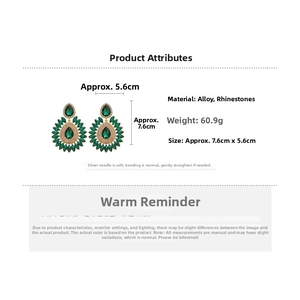 Macro view of teardrop emerald earrings with rhinestones and detailed dimensions
