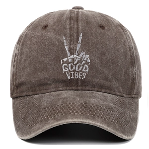 Washed cotton baseball cap in dark brown with Good Vibes bone gesture embroidery