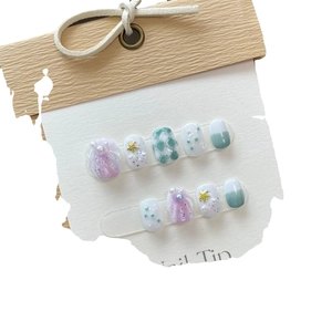 Handmade ocean-themed press-on nails with 3D shell, starfish, and pearl accents
