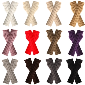 Fingerless cable knit arm warmers in assorted colors with thumb holes for winter