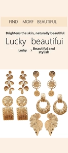 Detail showing five gold-plated alloy earrings with flower pearl and leaf patterns