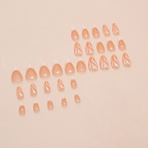 Press-on nail set with nude pink French design, white marble patterns and gold foil flakes