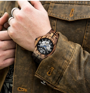 Close-up of a men's wooden automatic mechanical watch featuring a skeleton dial and wood grain