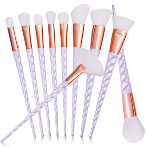 Set of 10 spiral handle makeup brushes with white synthetic bristles and rose gold ferrules