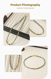 Detailed macro view of green stone beads and gold metal spacers on adjustable necklace
