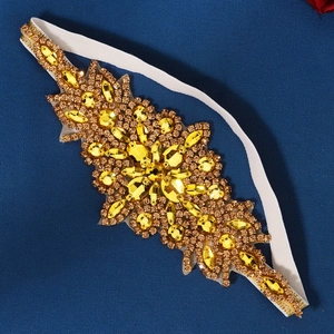 Bandeau élastique blanc avec strass en forme de feuilles dorées et cristaux champagne