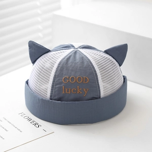 Detailed view of baby mesh brimless hat with cute cat ears and GOOD lucky embroidery