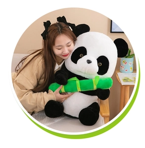 Detailed view of a large cute panda plush toy with bamboo being held by a model