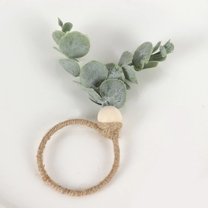 Detail of handmade eucalyptus leaf napkin ring with rustic jute rope and wood bead