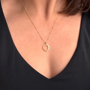 18K gold plated stainless steel sun and moon necklace on neck for minimalist jewelry look